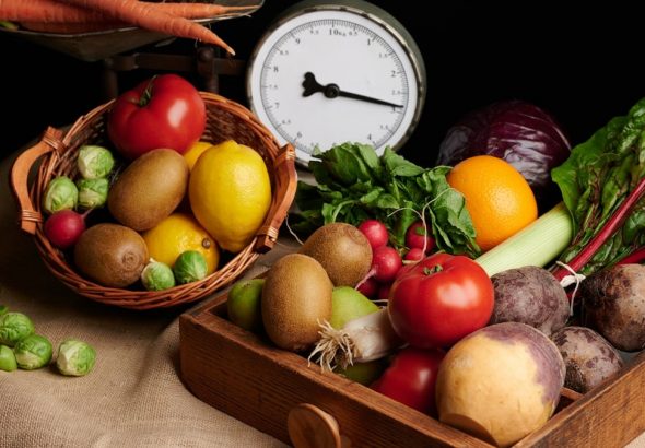 a wooden box filled with lots of different types of vegetables